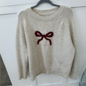 Cozy Cream Sweater with Red Bow